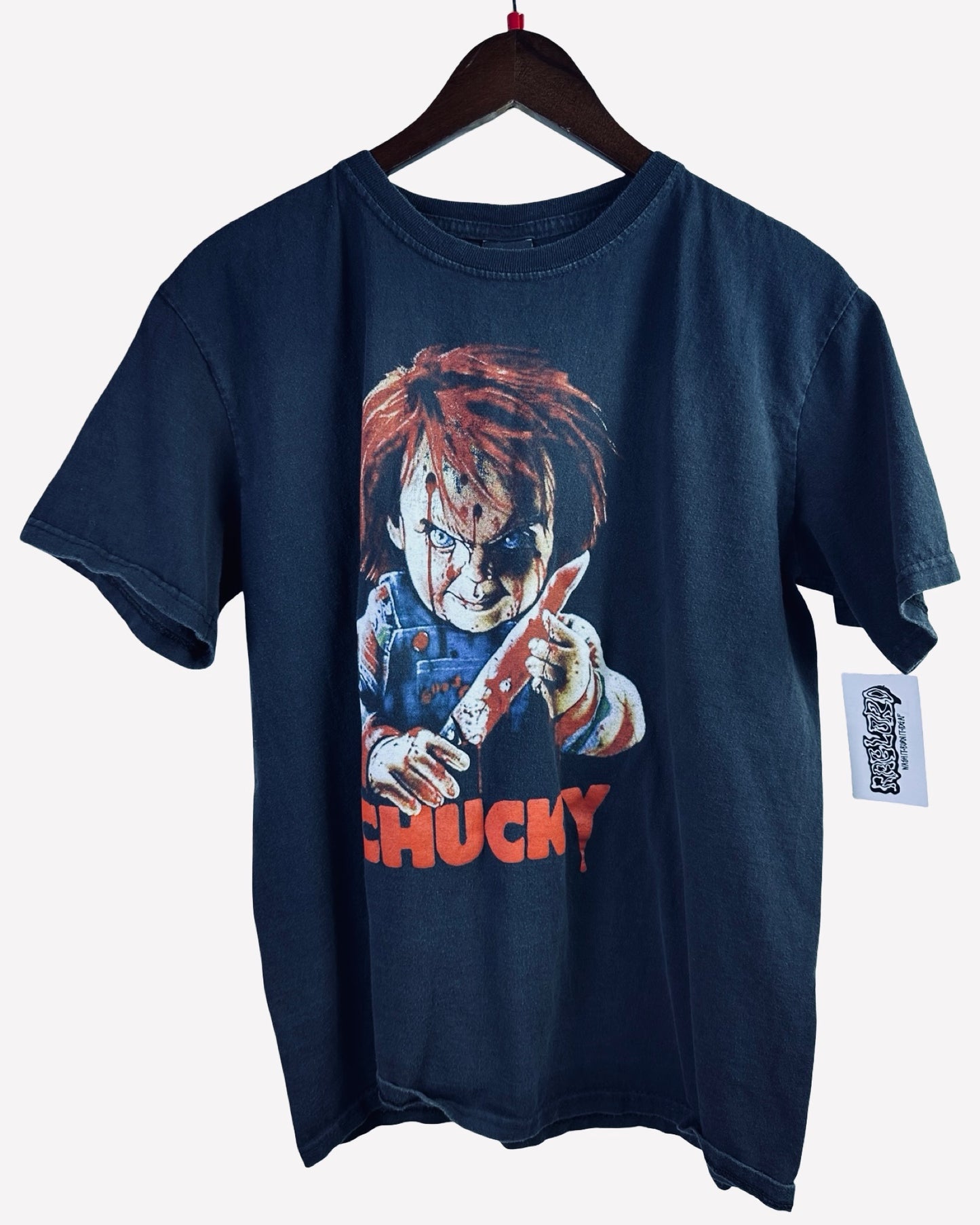 ( L ) Chucky Tee